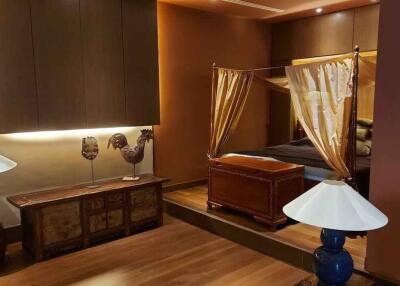 Elegant bedroom with canopy bed and decorative lamps