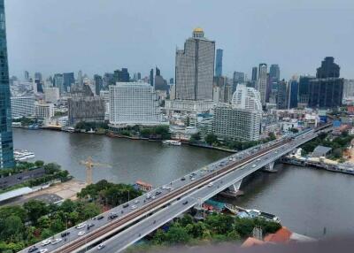 Aerial view of a city with high-rise buildings and a river