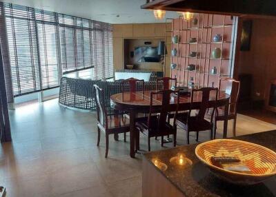 Spacious living room with dining area and large windows