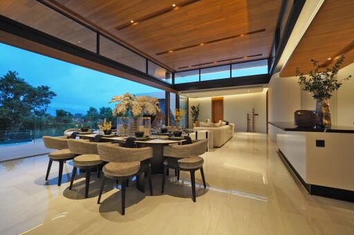 Modern open-concept living and dining area with large windows