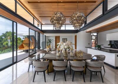 Spacious dining area with large glass windows and modern chandeliers