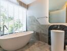 modern bathroom with bathtub and large window