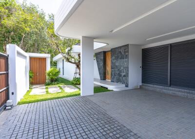 Modern house exterior with garage and covered entrance