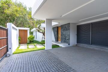 Modern house exterior with garage and covered entrance