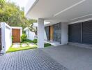 Modern house exterior with garage and covered entrance