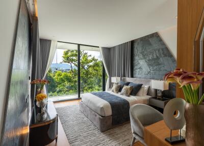 Modern bedroom with large windows and scenic view