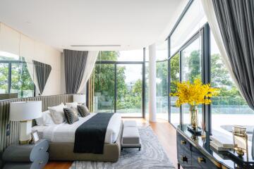 Luxury bedroom with large windows and modern decor