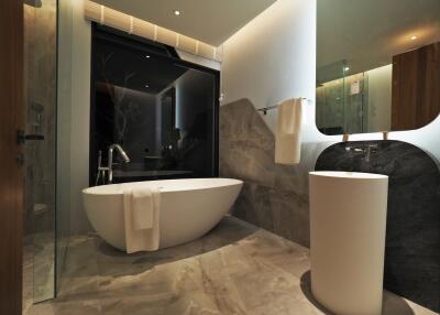 Modern bathroom with freestanding bathtub and stylish fixtures