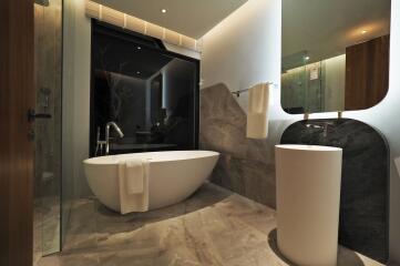 Modern bathroom with freestanding bathtub and stylish fixtures