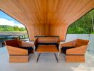 Modern balcony with wooden ceiling and furniture