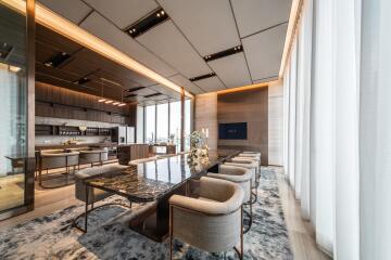 Luxurious modern dining room with a marble table and upholstered chairs.