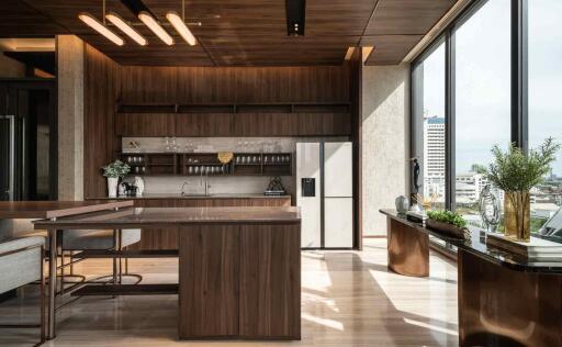 Modern kitchen with island and large windows