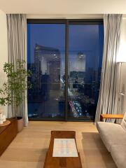 Living room with a view of the city at night