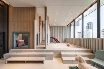 Modern playroom with indoor playground and city view