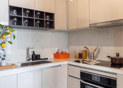 Modern kitchen with white cabinets and integrated appliances