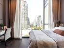 Modern bedroom with large window and city view