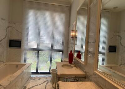 Luxurious bathroom with marble surfaces and twin sinks