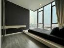 Modern bedroom with large windows and city view