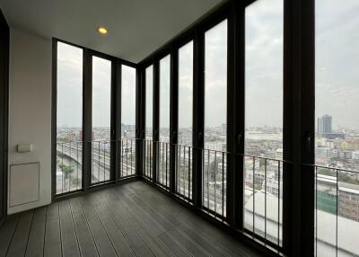 Modern balcony with floor-to-ceiling windows and city view