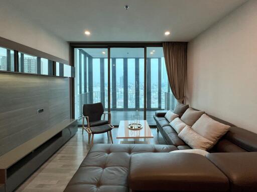 Modern living room with large windows and city view