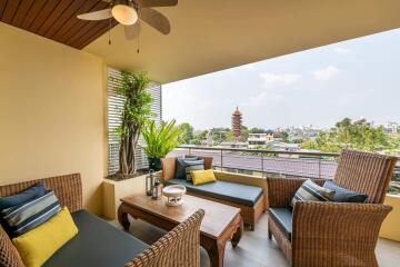 Cozy balcony with outdoor seating and a city view