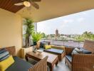 Cozy balcony with outdoor seating and a city view