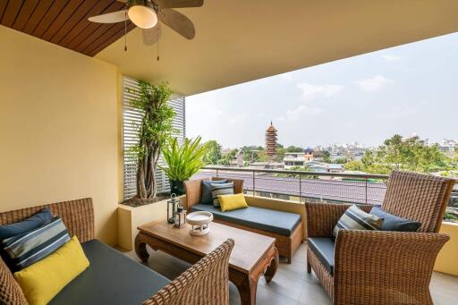 Cozy balcony with outdoor seating and a city view