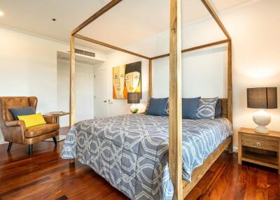 Cozy bedroom with a four-poster bed and comfortable seating