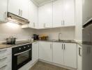 Modern kitchen with white cabinets and granite countertops