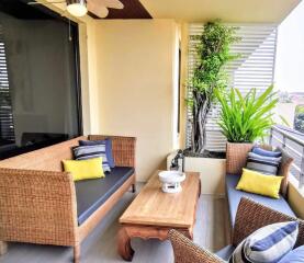 Well furnished balcony with seating and plants