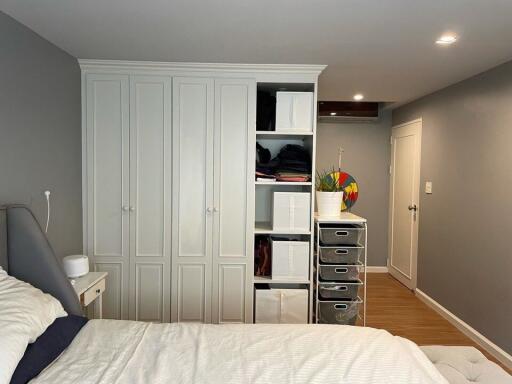 Bedroom with storage cabinets and drawers