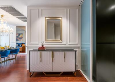 Elegant modern dining area with chandelier and sideboard