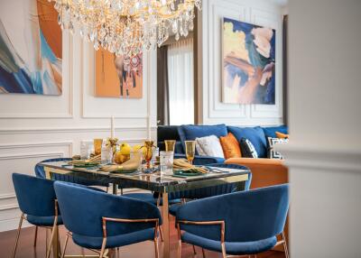 Elegantly decorated dining room with a chandelier