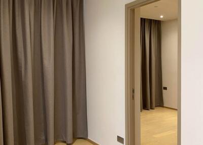 room with curtains and door