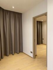 room with curtains and door