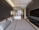 Modern bedroom with grey tones and built-in TV