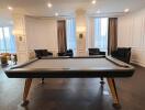 Modern living area with pool table