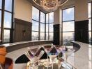 Modern bar area with panoramic city views and chandelier