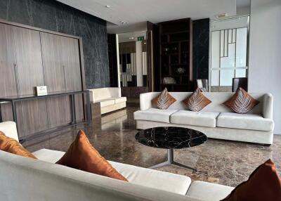 Modern living room with white sofas and marble floor