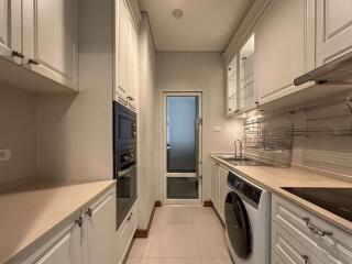 Modern kitchen with white cabinets and appliances