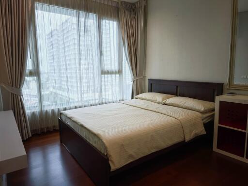 Bedroom with large window and natural light