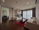 Spacious living room with large windows and natural light