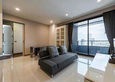 Modern living room with a large window and city view