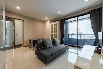 Modern living room with a large window and city view