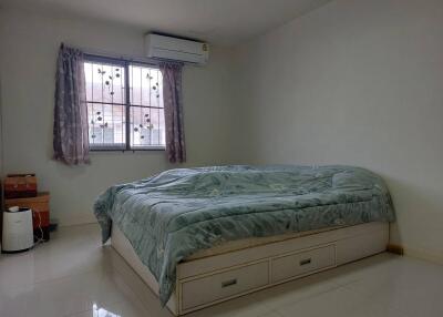 Bedroom with window and air conditioning