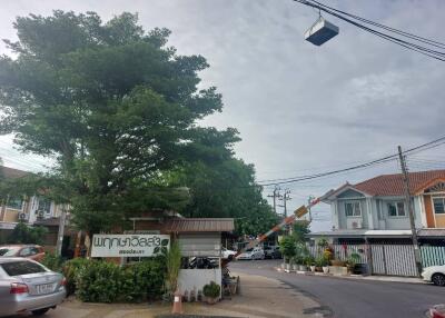 Street view of residential neighborhood with houses and trees