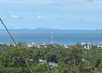 Scenic ocean view with islands and a radio tower