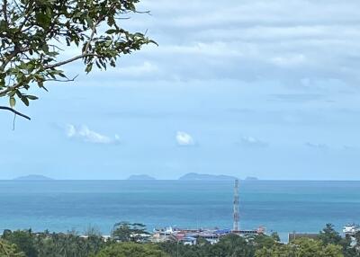 ocean view with distant islands and coastal buildings