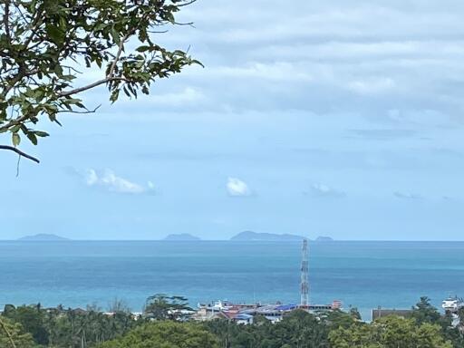 ocean view with distant islands and coastal buildings