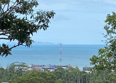 Scenic view of ocean and greenery